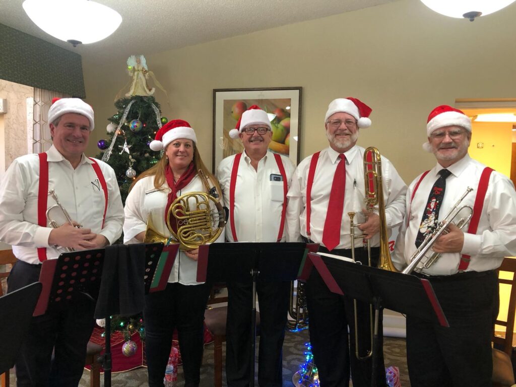 Grand Court retirement home Christmas Party, December of 2019. Left to right: Terry Driscroll, Meg Walter, James Nance, Timothy Burt, and Paul Stapp.